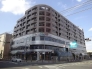 本八幡駅近くの角地！１階から３階に商業施設が入っている便利なマンションです。